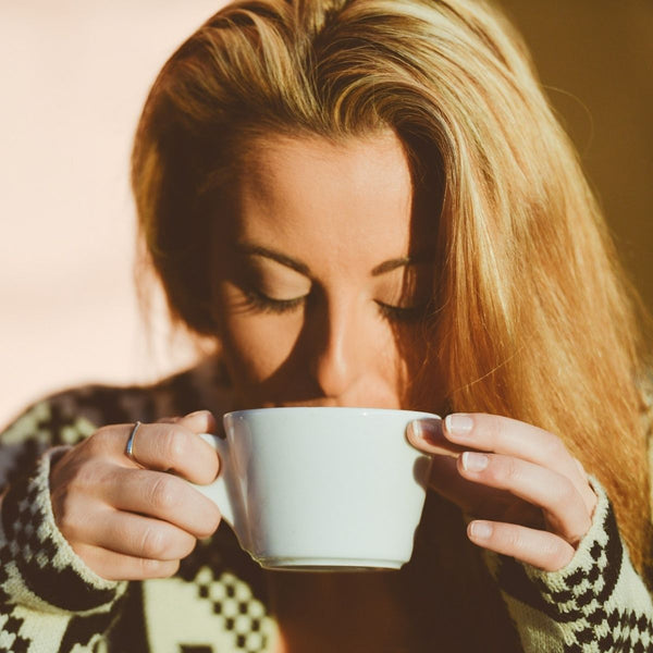 woman drinking coffee - a nootropic
