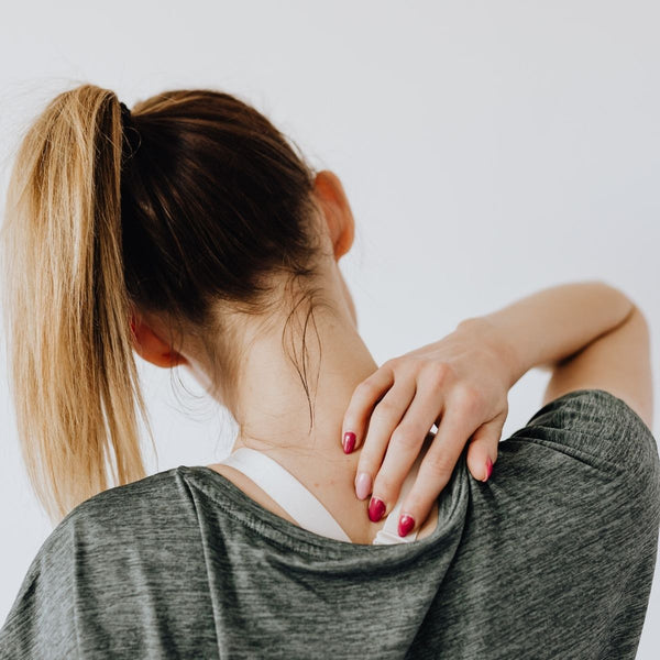 woman with sore neck after exercise